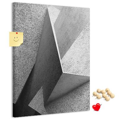Bacheca di sughero con geometrie concrete in diverse tonalità di grigio
