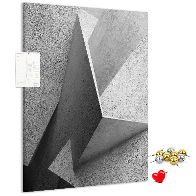 Bacheca di sughero con geometrie concrete in diverse tonalità di grigio