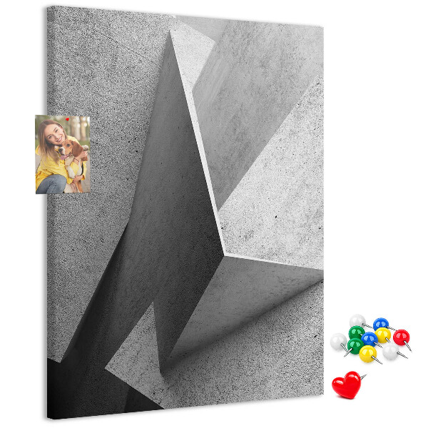 Bacheca di sughero con geometrie concrete in diverse tonalità di grigio