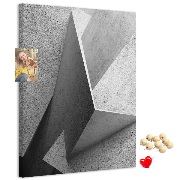 Bacheca di sughero con geometrie concrete in diverse tonalità di grigio