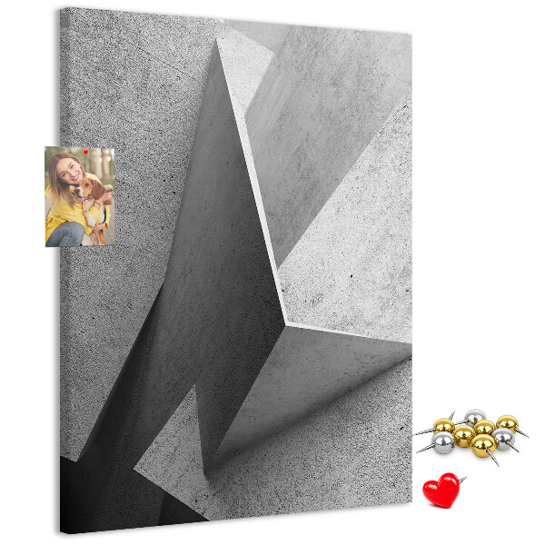 Bacheca di sughero con geometrie concrete in diverse tonalità di grigio