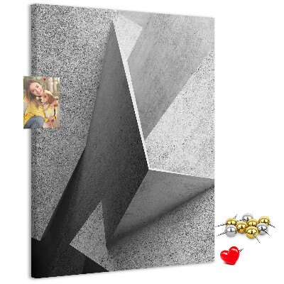 Bacheca di sughero con geometrie concrete in diverse tonalità di grigio