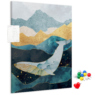 Lavagna in sughero con illustrazione di una balena tra onde oceaniche imponenti