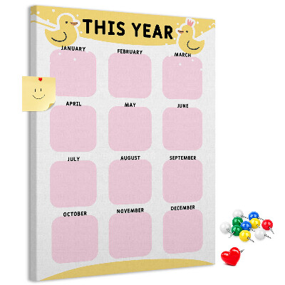 Bacheca di sughero con un allegro calendario a motivo uccellino
