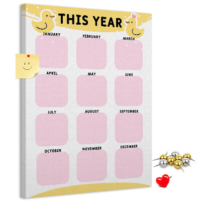 Bacheca di sughero con un allegro calendario a motivo uccellino