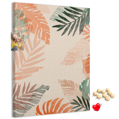 Bacheca di sughero con stampa di foglie tropicali dai colori delicati