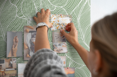 Bacheca di sughero con stampa di foglie delicate su sfondo verde