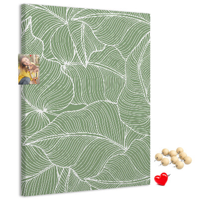 Bacheca di sughero con stampa di foglie delicate su sfondo verde