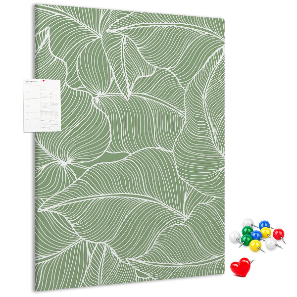 Bacheca di sughero con stampa di foglie delicate su sfondo verde