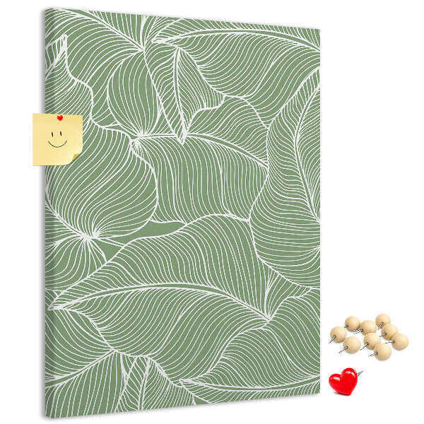 Bacheca di sughero con stampa di foglie delicate su sfondo verde