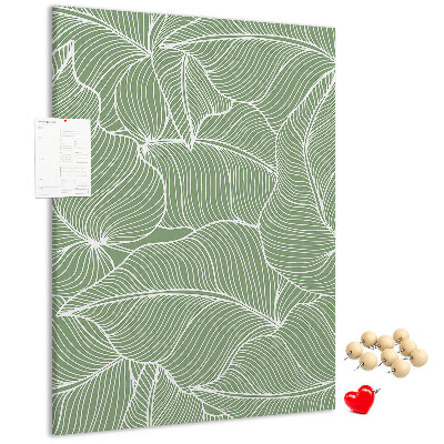 Bacheca di sughero con stampa di foglie delicate su sfondo verde