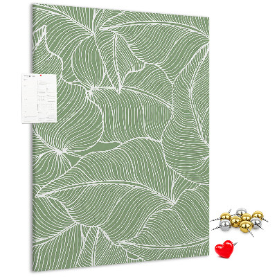 Bacheca di sughero con stampa di foglie delicate su sfondo verde