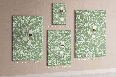 Bacheca di sughero con stampa di foglie delicate su sfondo verde