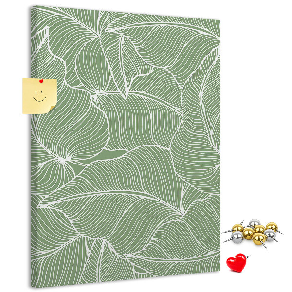 Bacheca di sughero con stampa di foglie delicate su sfondo verde