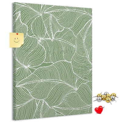 Bacheca di sughero con stampa di foglie delicate su sfondo verde