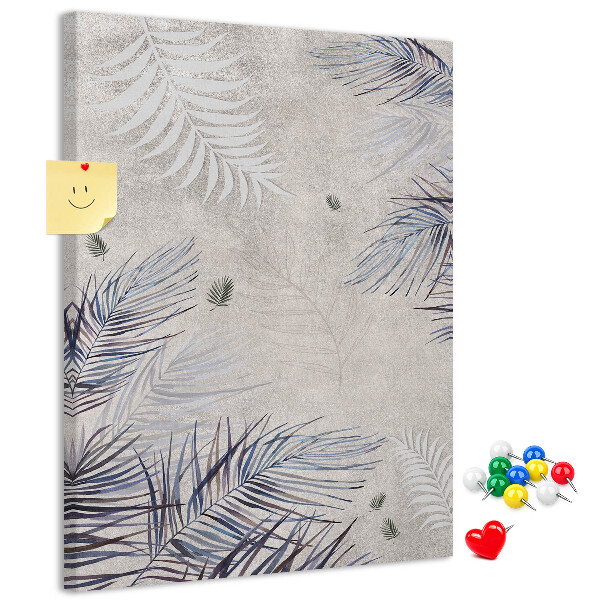 Bacheca di sughero con stampa di foglie delicate su sfondo grigio