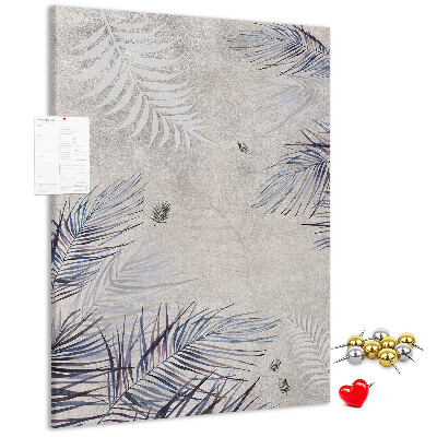 Bacheca di sughero con stampa di foglie delicate su sfondo grigio