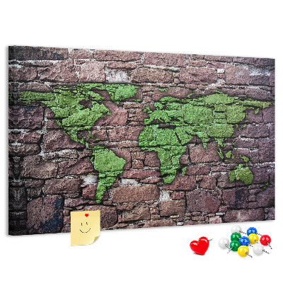 Bacheca in sughero mappa del mondo verde su muro di pietra