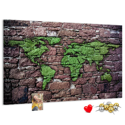 Bacheca in sughero mappa del mondo verde su muro di pietra