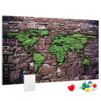 Bacheca in sughero mappa del mondo verde su muro di pietra