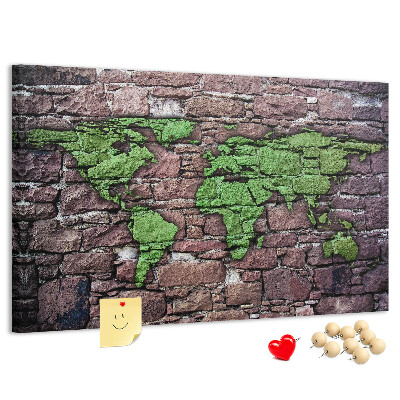 Bacheca in sughero mappa del mondo verde su muro di pietra