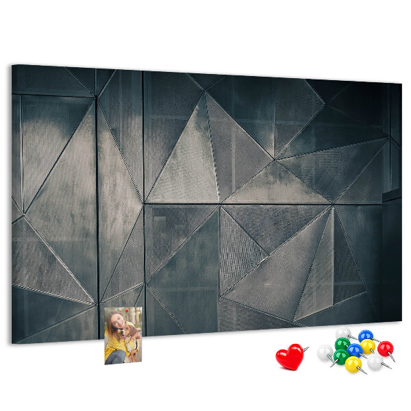 Lavagna di sughero con forme geometriche in diverse tonalità di grigio