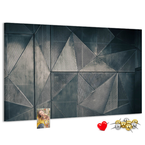 Lavagna di sughero con forme geometriche in diverse tonalità di grigio