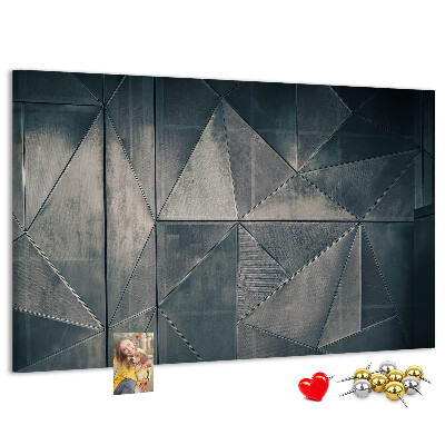 Lavagna di sughero con forme geometriche in diverse tonalità di grigio