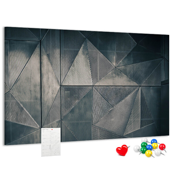 Lavagna di sughero con forme geometriche in diverse tonalità di grigio