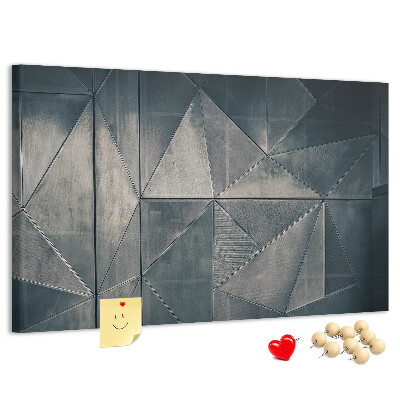 Lavagna di sughero con forme geometriche in diverse tonalità di grigio
