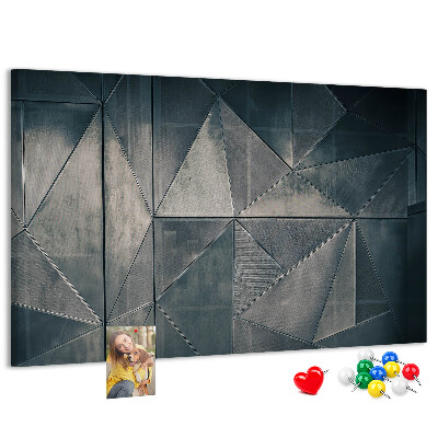 Lavagna di sughero con forme geometriche in diverse tonalità di grigio
