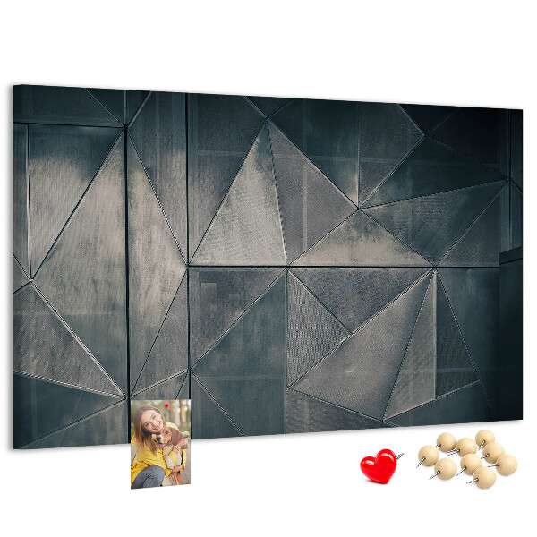 Lavagna di sughero con forme geometriche in diverse tonalità di grigio