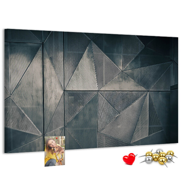 Lavagna di sughero con forme geometriche in diverse tonalità di grigio