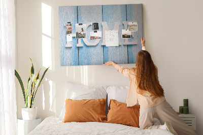 Bacheca in sughero con scritta decorativa Home su sfondo blu
