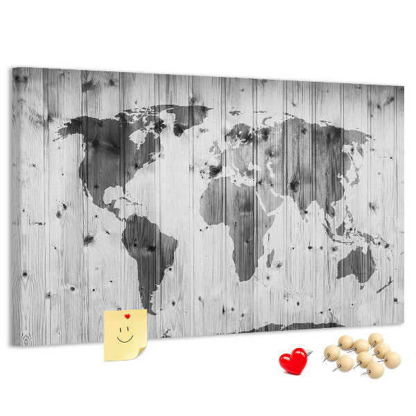 Lavagna di sughero con mappa del mondo su sfondo di assi di legno