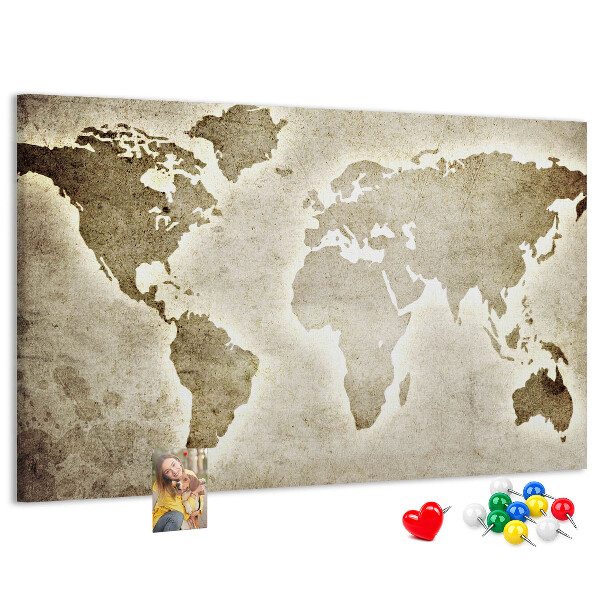 Bacheca in sughero con stampa di una vecchia mappa del mondo sullo sfondo