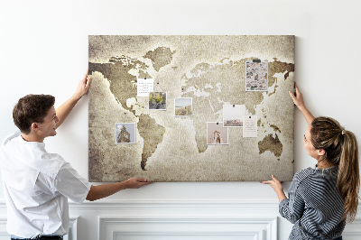 Bacheca in sughero con stampa di una vecchia mappa del mondo sullo sfondo