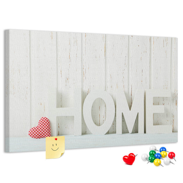 Bacheca in sughero con scritta HOME elegante su sfondo bianco