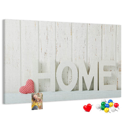 Bacheca in sughero con scritta HOME elegante su sfondo bianco
