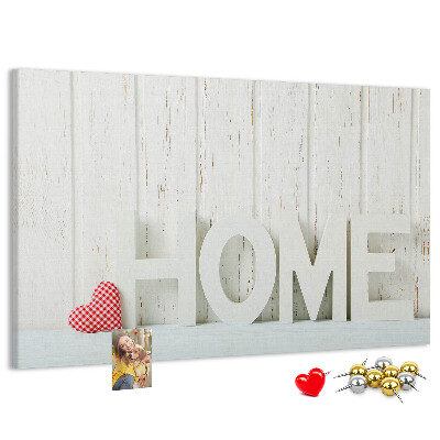 Bacheca in sughero con scritta HOME elegante su sfondo bianco