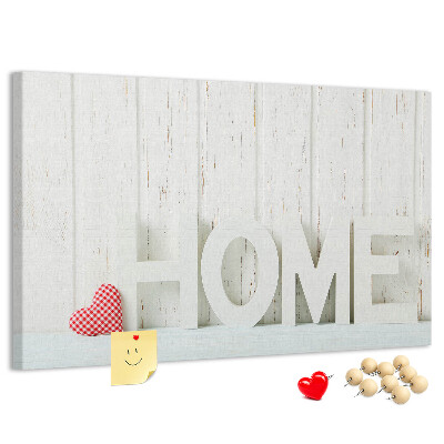 Bacheca in sughero con scritta HOME elegante su sfondo bianco