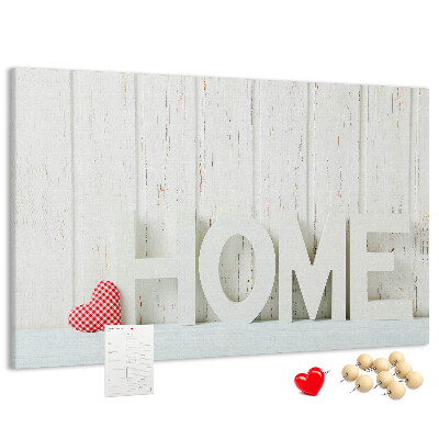 Bacheca in sughero con scritta HOME elegante su sfondo bianco