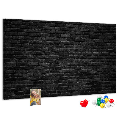 Lavagna di sughero con texture di muro in mattoni scuri dalla superficie ruvida