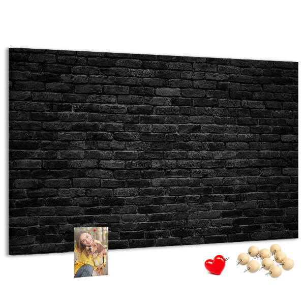 Lavagna di sughero con texture di muro in mattoni scuri dalla superficie ruvida