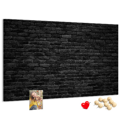 Lavagna di sughero con texture di muro in mattoni scuri dalla superficie ruvida