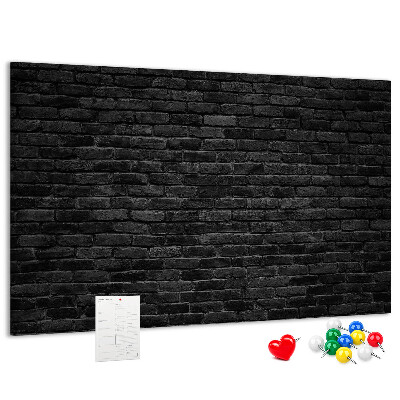 Lavagna di sughero con texture di muro in mattoni scuri dalla superficie ruvida