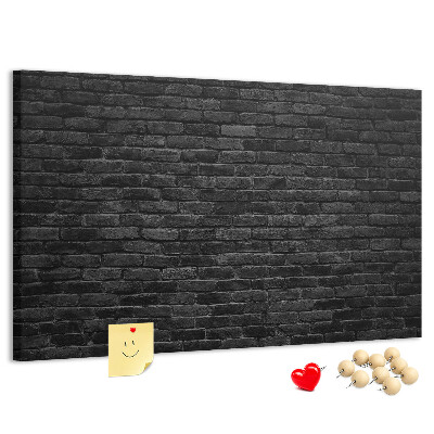 Lavagna di sughero con texture di muro in mattoni scuri dalla superficie ruvida