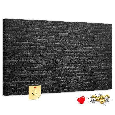 Lavagna di sughero con texture di muro in mattoni scuri dalla superficie ruvida