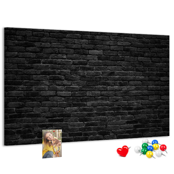 Lavagna di sughero con texture di muro in mattoni scuri dalla superficie ruvida