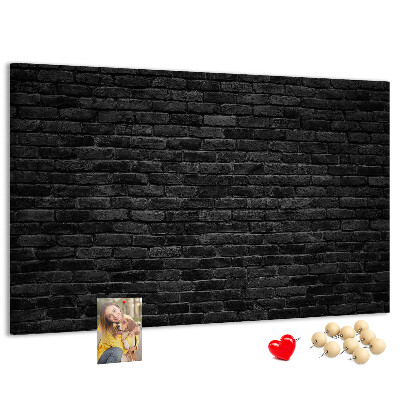 Lavagna di sughero con texture di muro in mattoni scuri dalla superficie ruvida
